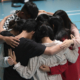 A bullseye group hugging and praying with each other during Pacific East Cluster's Discovery Camp Chosen 2019